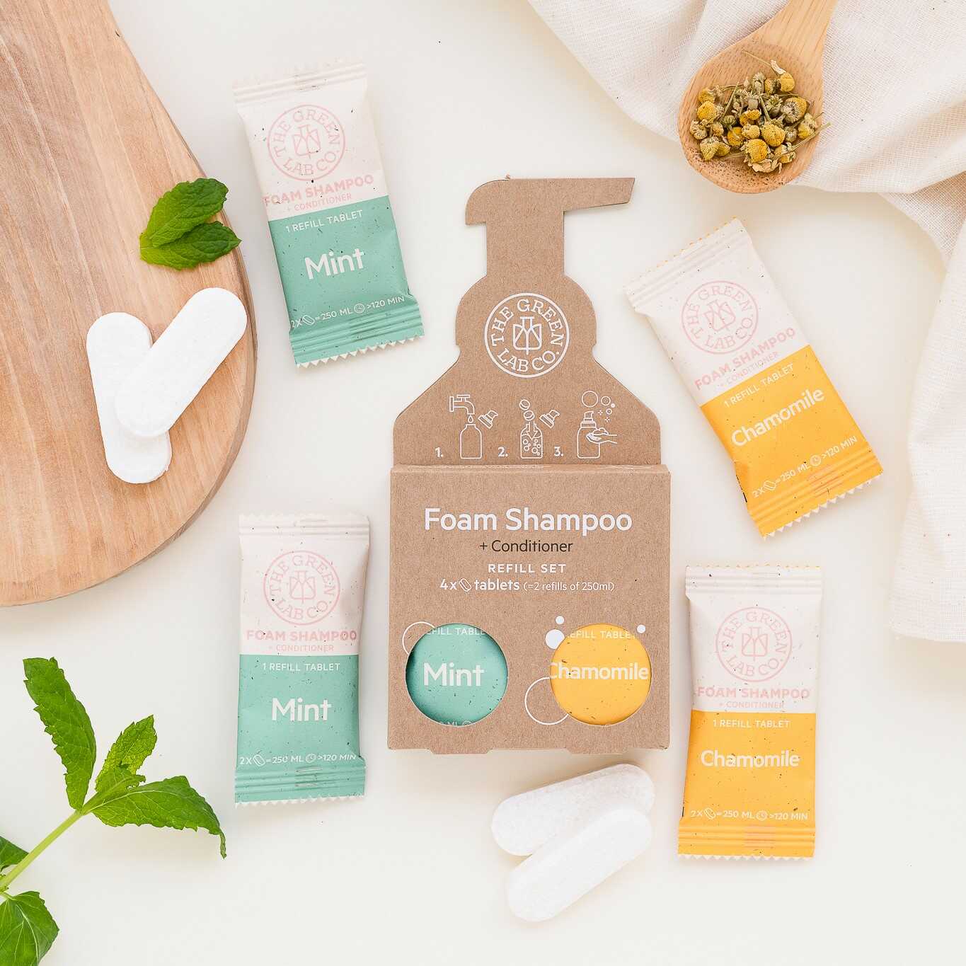 The Green Lab Co foam shampoo + conditioner refill set—Mint & Chamomile tablets on a light background.